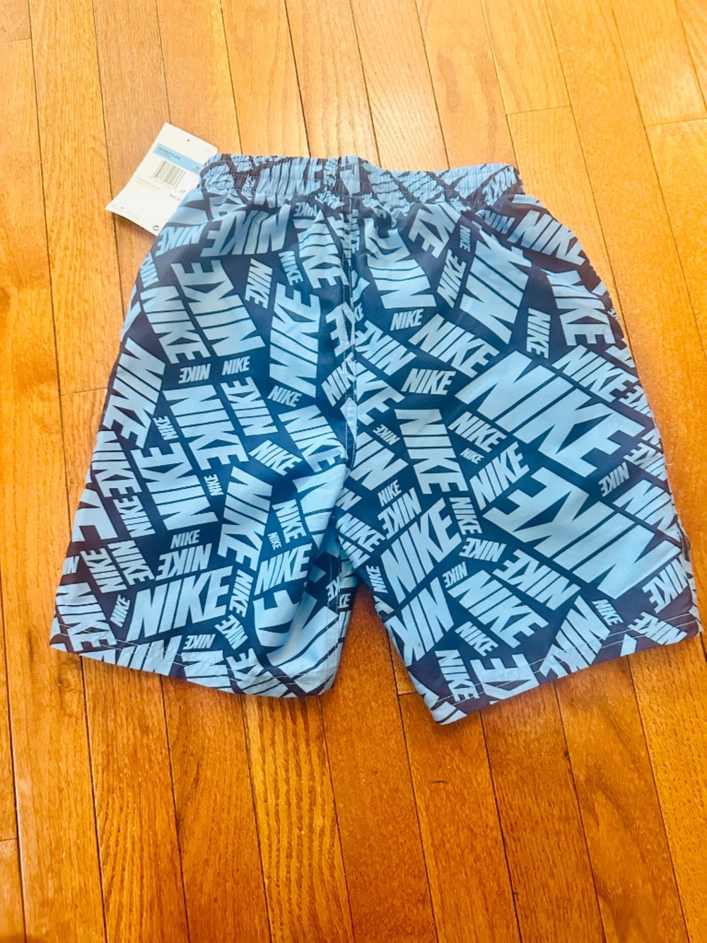 Nike Boys Swim Trunks Blue All-Over Logo Print – Size M (NWT) Athletic Shorts - Picture 2 of 3